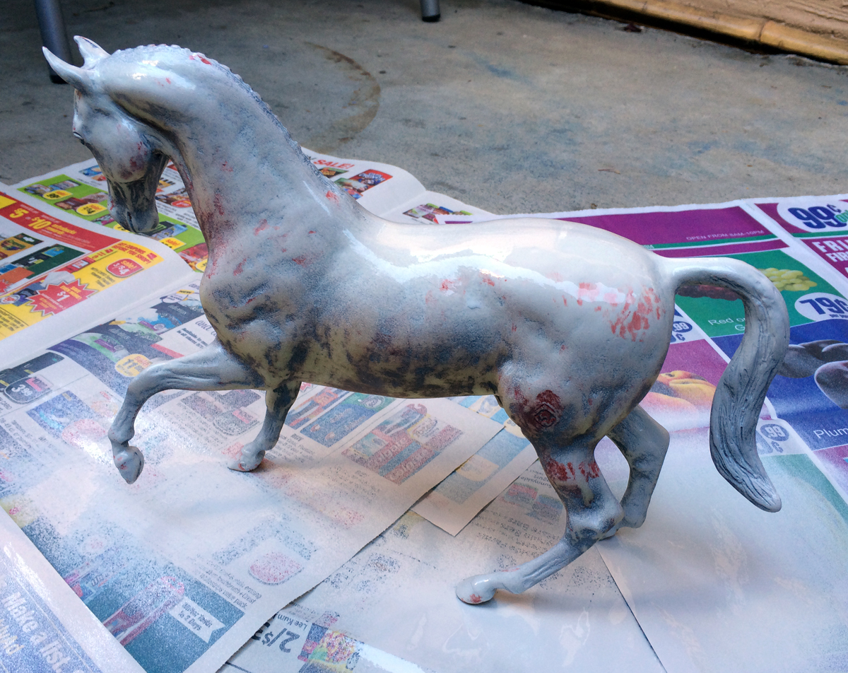 Do It Yourself of repainting Breyer model for home decor. Spraying light first layer.